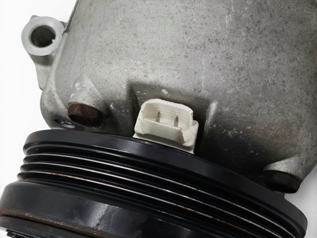 Send it Auto Parts OEM GM air conditioning compressor for 1997-2004 Corvette C5 showing the electrical connector