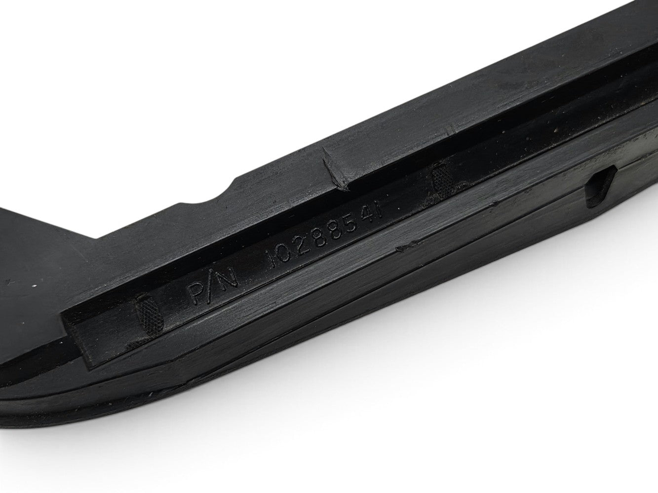 Send it Auto Parts OEM black front license plate holder bezel for 1997-2004 Corvette C5 showing part number 10288541