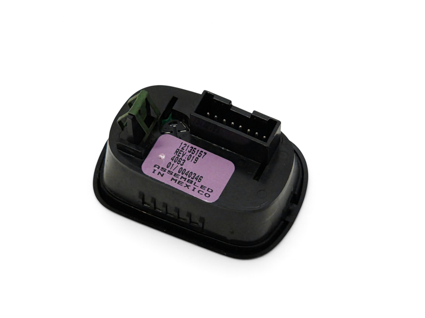 Send it Auto Parts OEM GM trunk hatch release button switch for 1997-2004 Chevrolet Corvette C5, rear view.