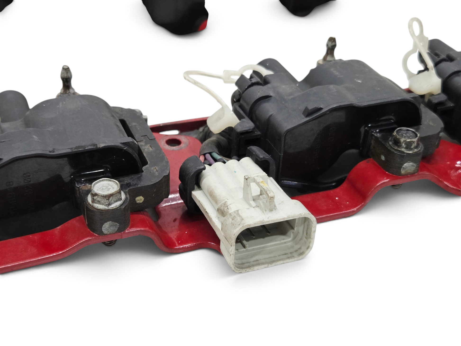 Send it Auto Parts OEM GM LS1 LS6 ignition coil set with red mounting brackets and wiring harness for V8 engines.