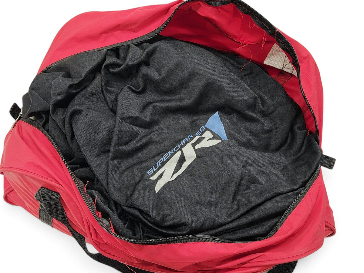Send it Auto Parts OEM black Corvette C6 ZR1 indoor car cover stored inside a red zippered carry bag