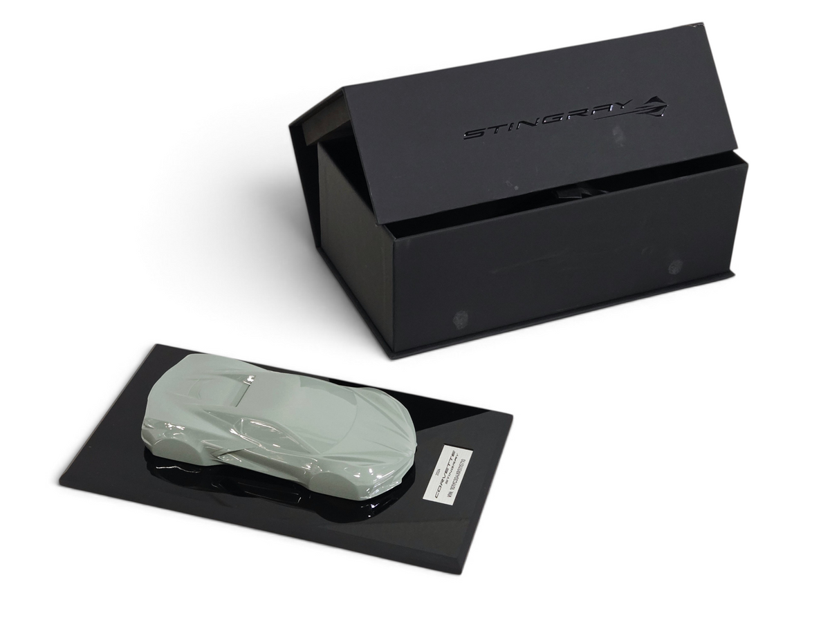 Send it Auto Parts 1:18 scale Cacti Green Corvette C8 speedshape model on a black display base with matching box.