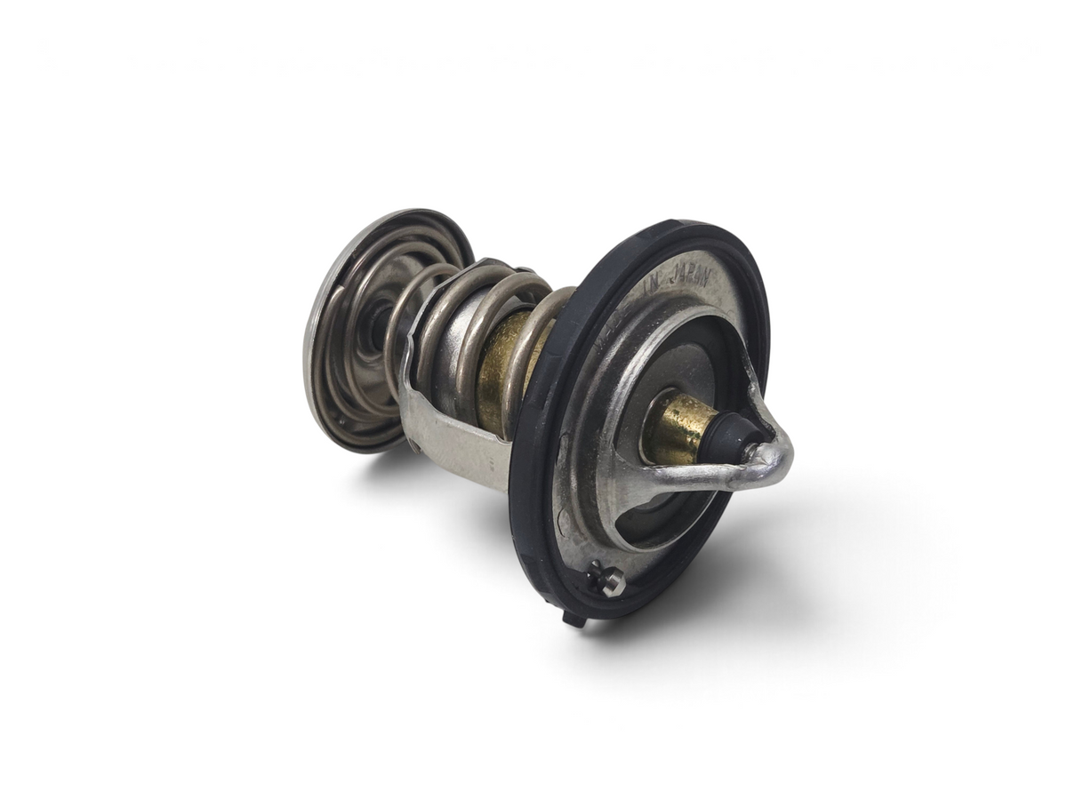 Send it Auto Parts OEM GM engine coolant thermostat for Chevrolet Corvette C8, featuring metal spring and rubber seal.
