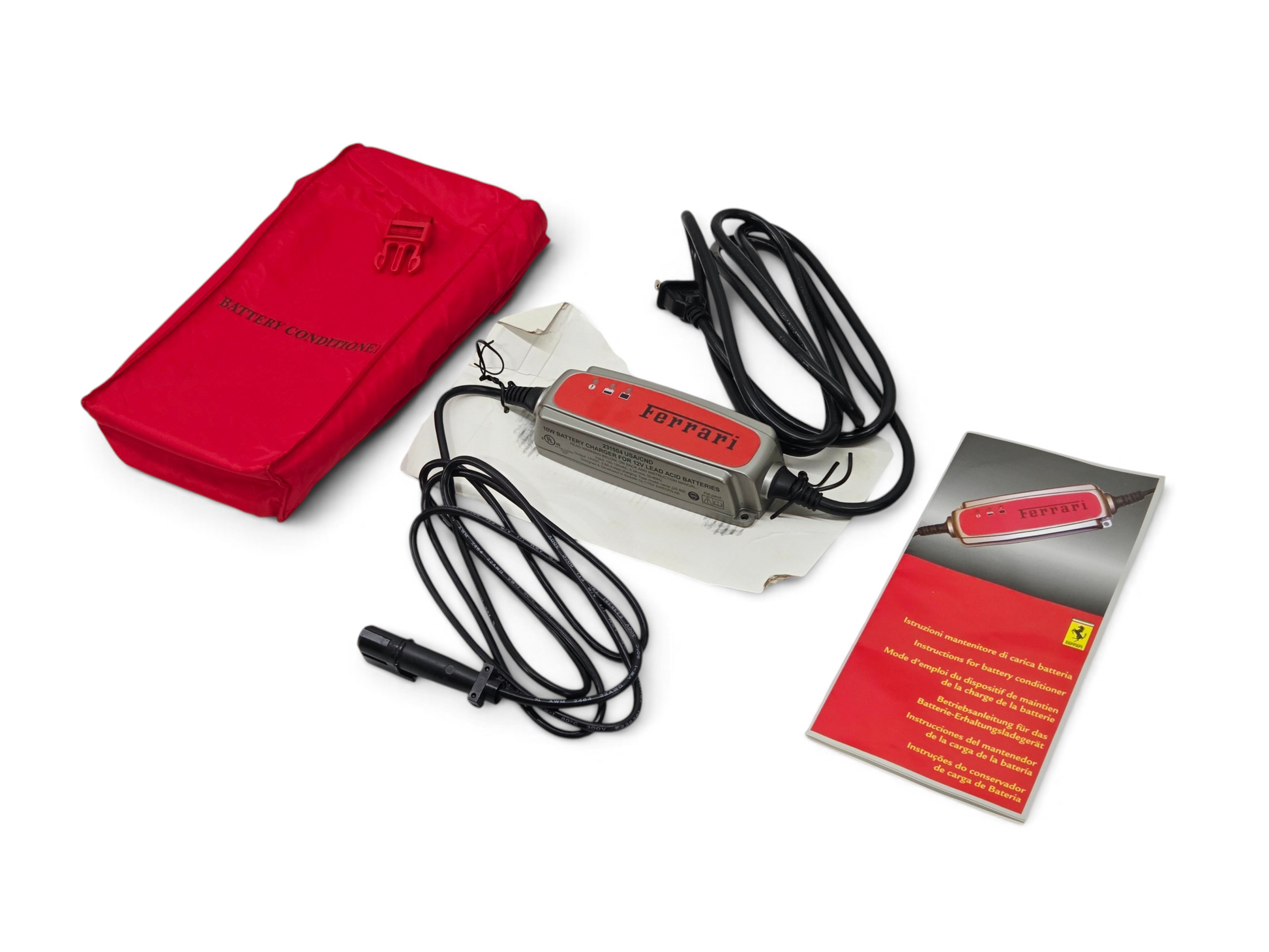 Send it Auto Parts OEM Ferrari battery charger with red carry case and manual for 458 F430 612 599 California models