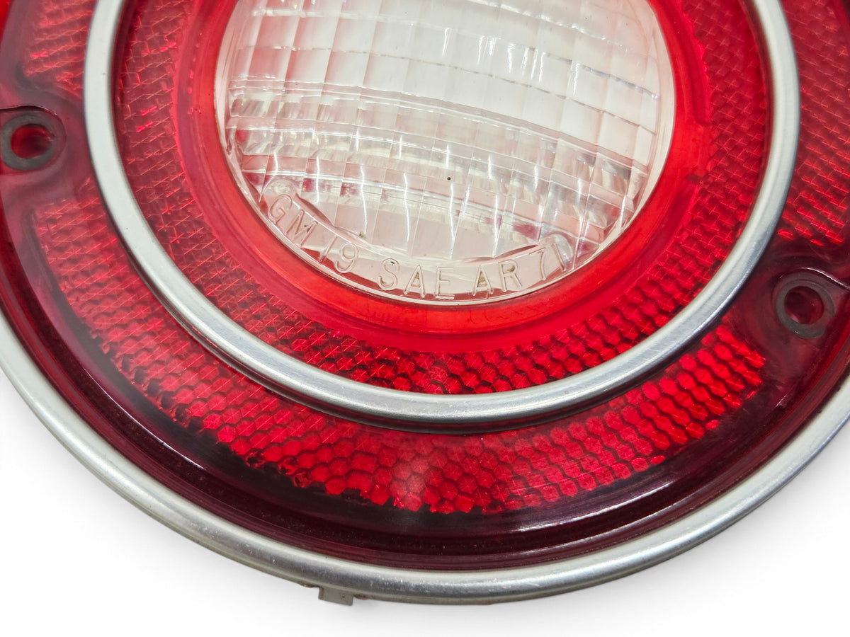 Send it Auto Parts OEM 1971 Corvette backup lamp tail light lens with red and clear plastic housing