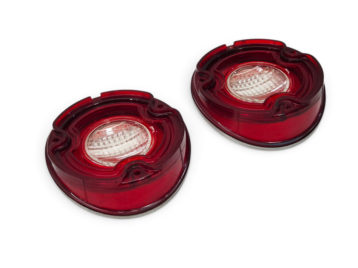 Send it Auto Parts OEM 1971 Corvette backup lamp tail light lenses in red and clear plastic, free of cracks.