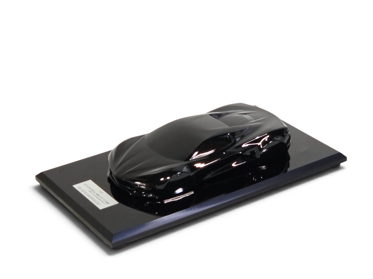 Send it Auto Parts 1:18 scale black 2023 Corvette C8 speedshape model on a display base