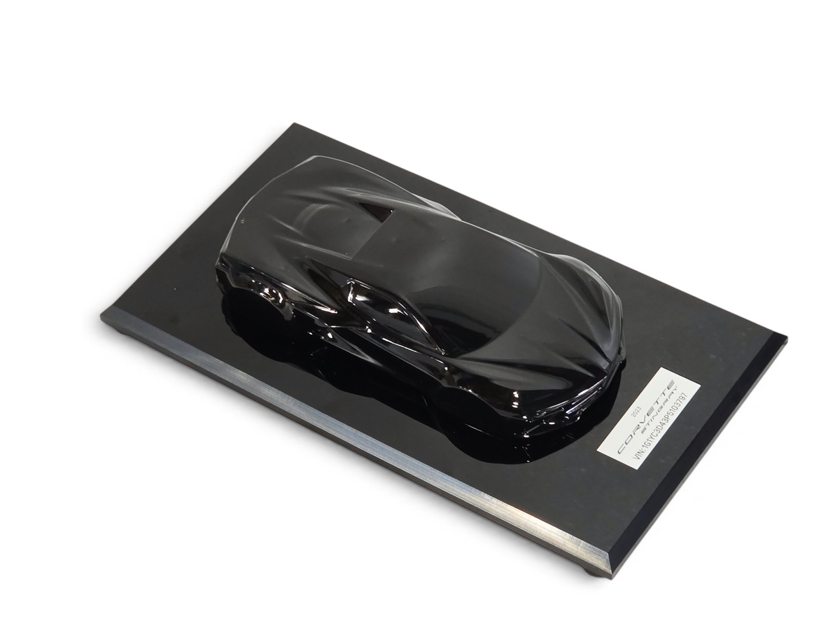 Send it Auto Parts 1:18 scale black 2023 Corvette C8 speedshape model on a display base with VIN plate