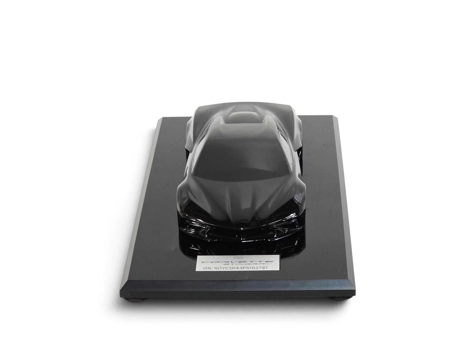 Send it Auto Parts 1:18 scale black 2023 Corvette C8 speedshape model on a black display base