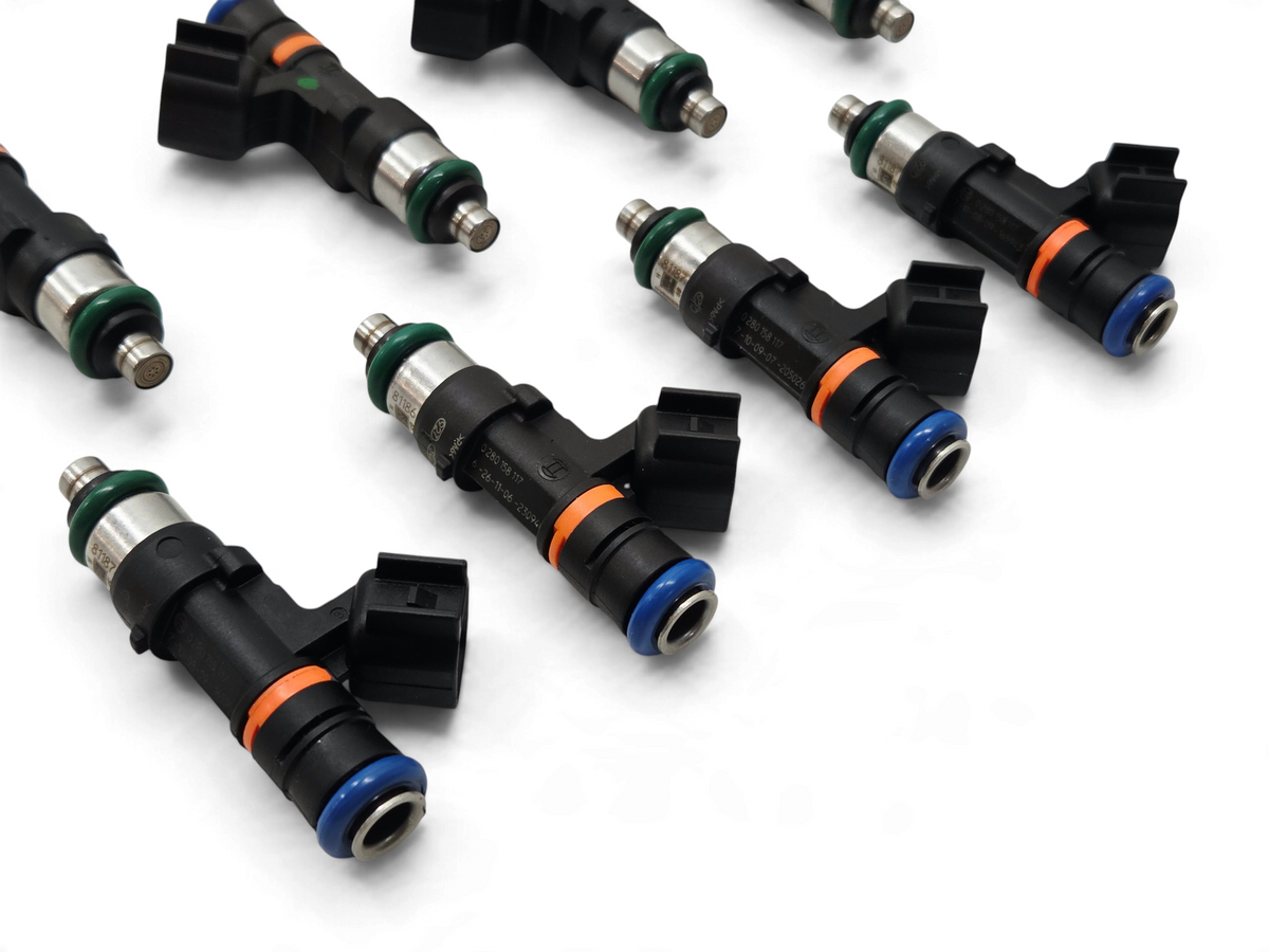 Send it Auto Parts set of eight genuine Bosch 0280158117 550cc EV14 fuel injectors with black bodies and blue seals.