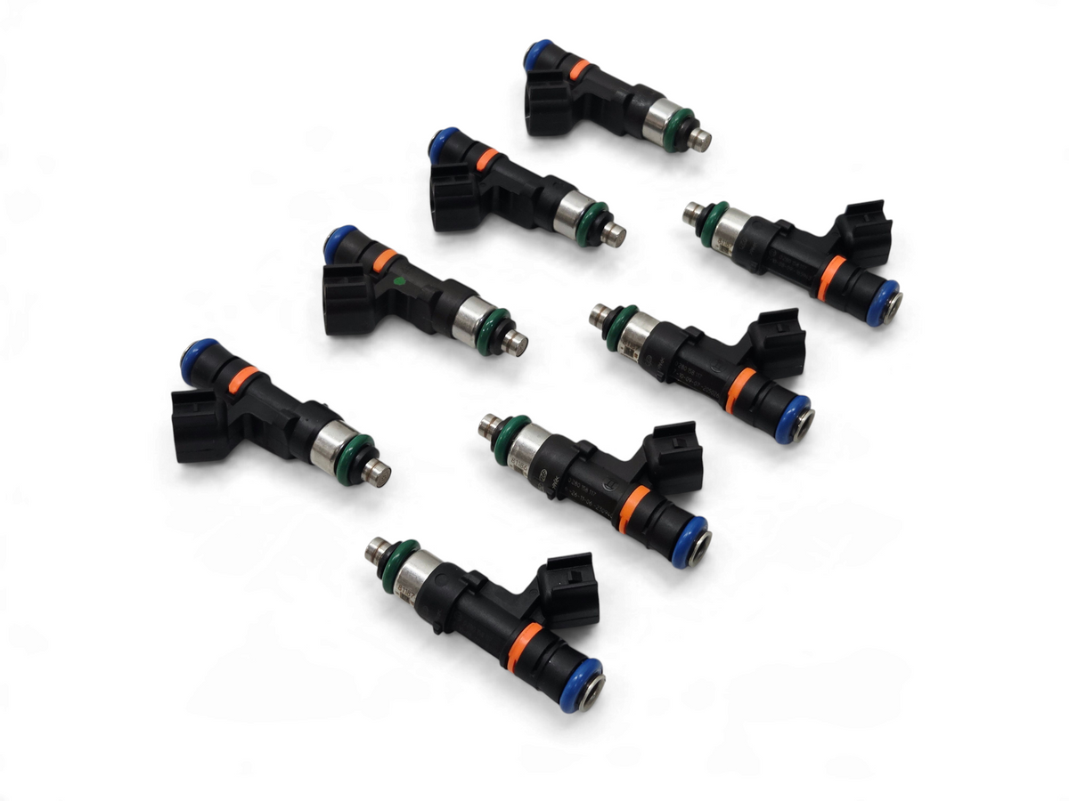 Send it Auto Parts set of eight genuine Bosch 0280158117 550cc EV14 fuel injectors with black bodies and blue caps.
