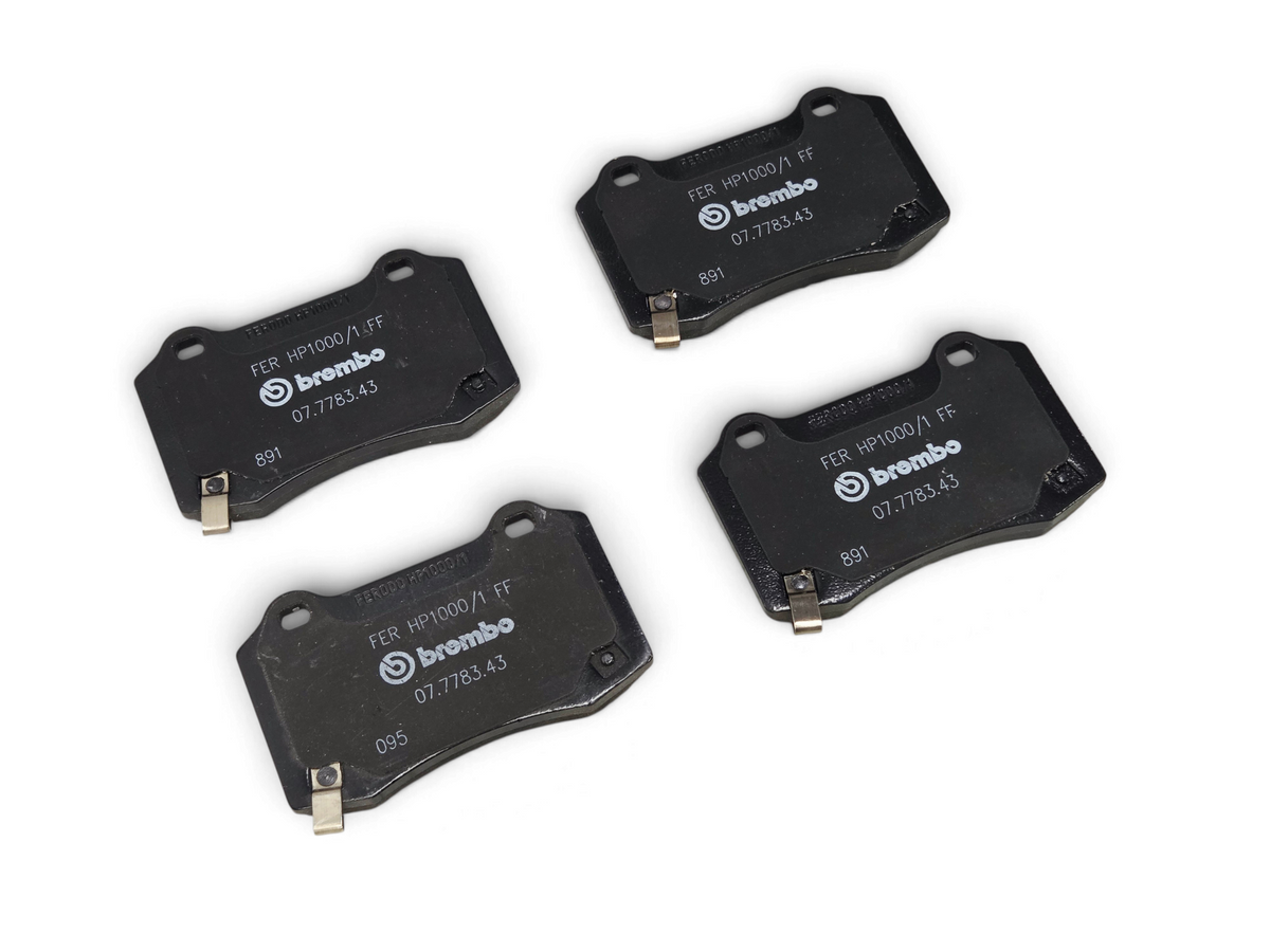 Send it Auto Parts Brembo rear disc brake pads for Camaro ZL1 and CTS-V, black performance brake components.
