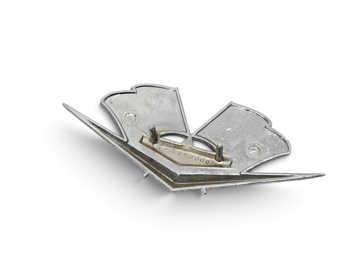 Send it Auto Parts OEM 1962-1963 C2 Corvette fender cross flags emblem, showing the back side with mounting pins.