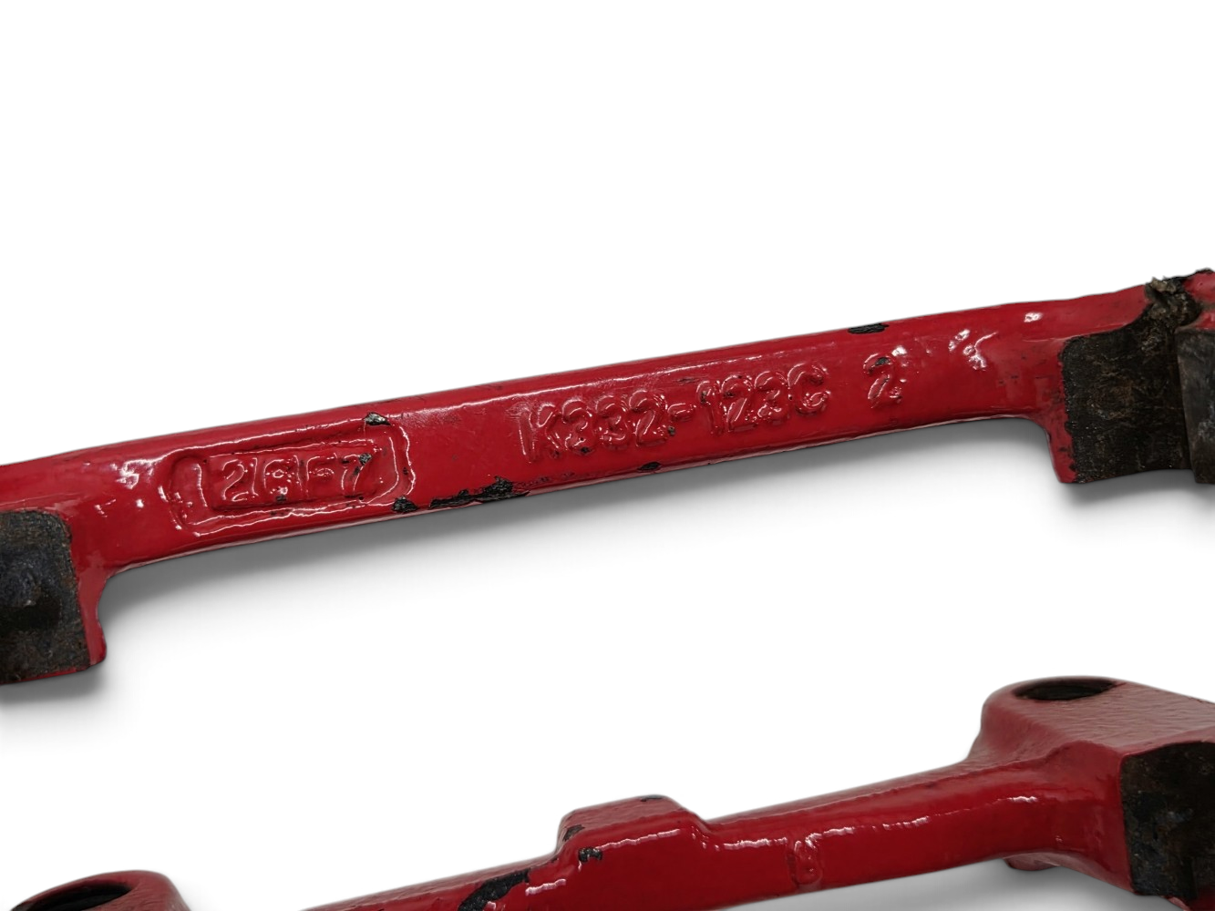 Send it Auto Parts OEM GM rear brake caliper brackets for C5 Corvette with red painted finish and chipping paint