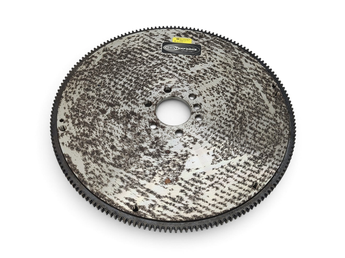 Send it Auto Parts Centerforce billet steel flywheel for LS engines with visible surface rust on the metal surface.