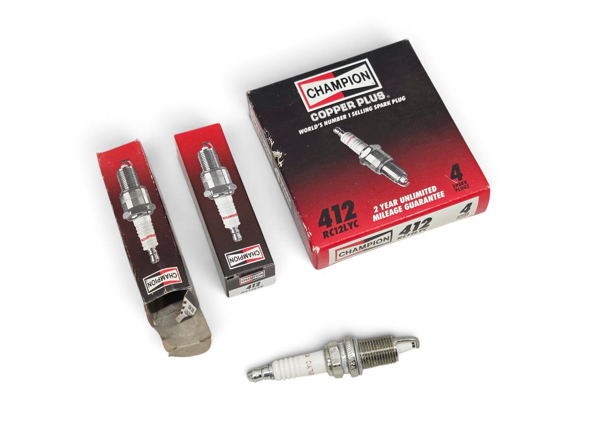 Send it Auto Parts Champion RC12LYC 412 copper core spark plugs with original red and black packaging boxes