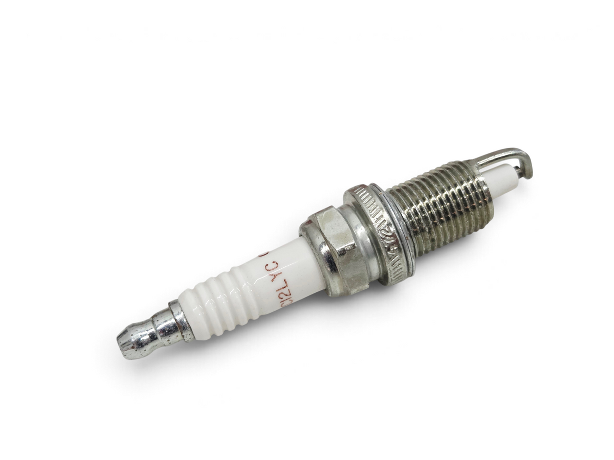 Send it Auto Parts Champion RC12LYC 412 copper core spark plug with white ceramic insulator and metal threaded base