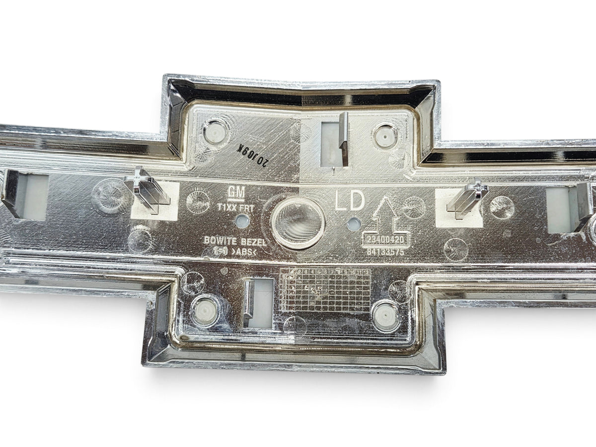 Send it Auto Parts OEM Chevrolet Silverado 1500 front grille bowtie emblem back view showing part numbers