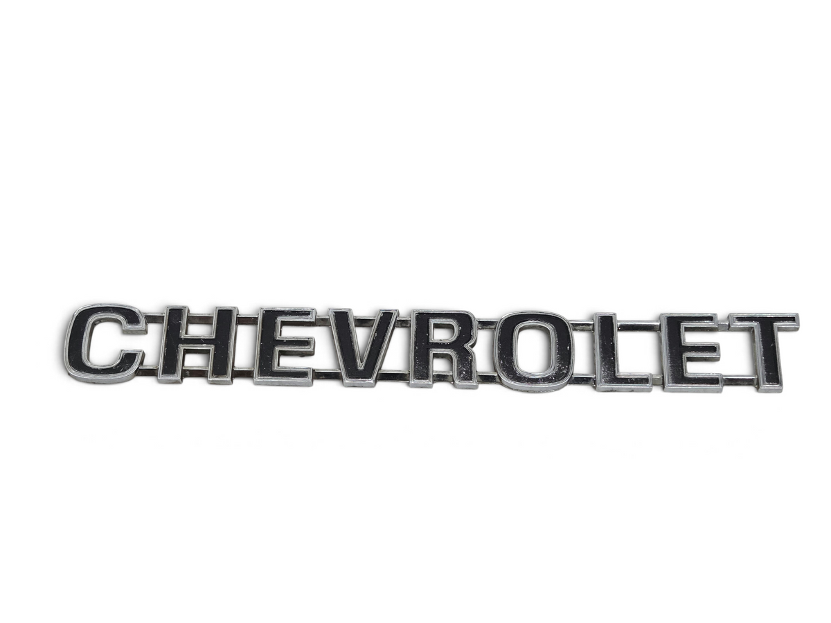 Send it Auto Parts OEM 1973-1980 Chevrolet truck tailgate script emblem with chrome finish and black lettering