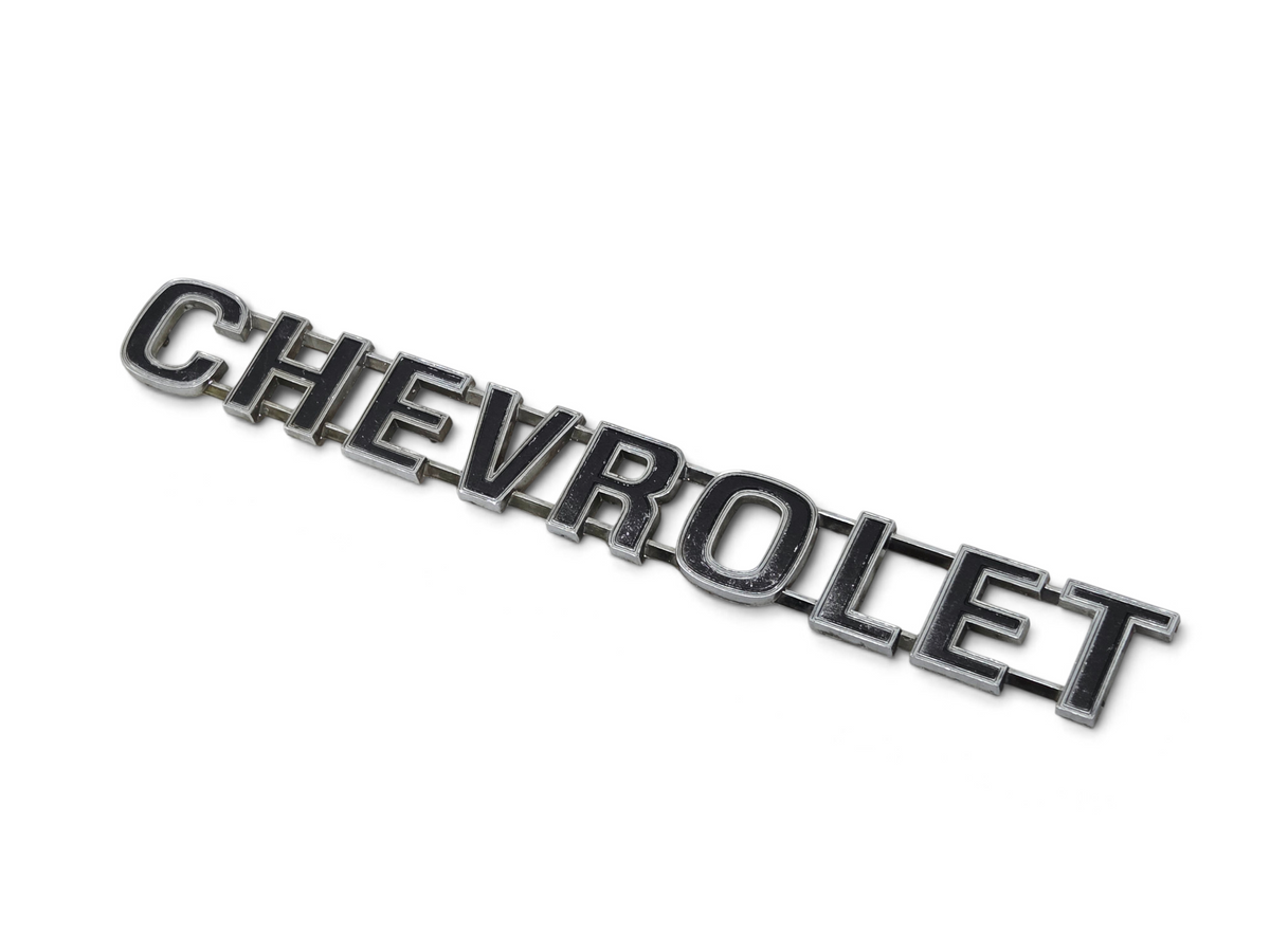 Send it Auto Parts vintage chrome Chevrolet tailgate emblem for 1973-1980 trucks with minor wear and missing pins