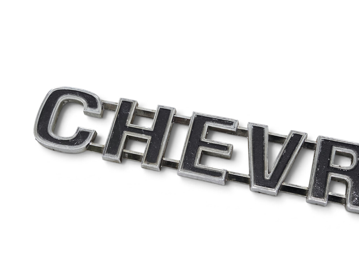 Send it Auto Parts OEM Chevrolet tailgate script emblem for 1973-1980 trucks with black and chrome finish