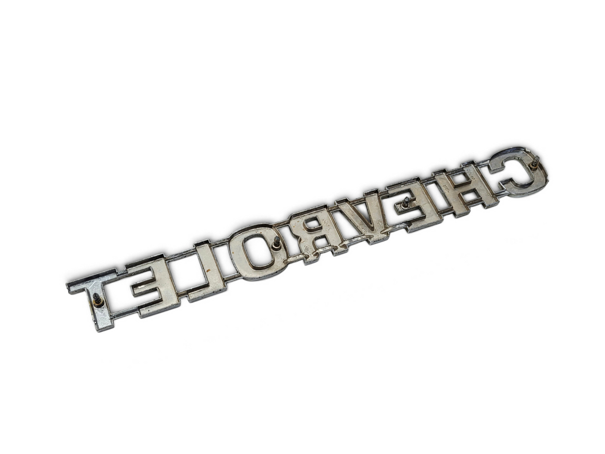 Send it Auto Parts vintage chrome Chevrolet tailgate script emblem for 1973-1980 Chevy trucks with minor wear