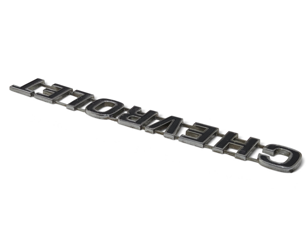 Send it Auto Parts vintage chrome Chevrolet tailgate emblem for 1973-1980 trucks with minor wear and missing pins