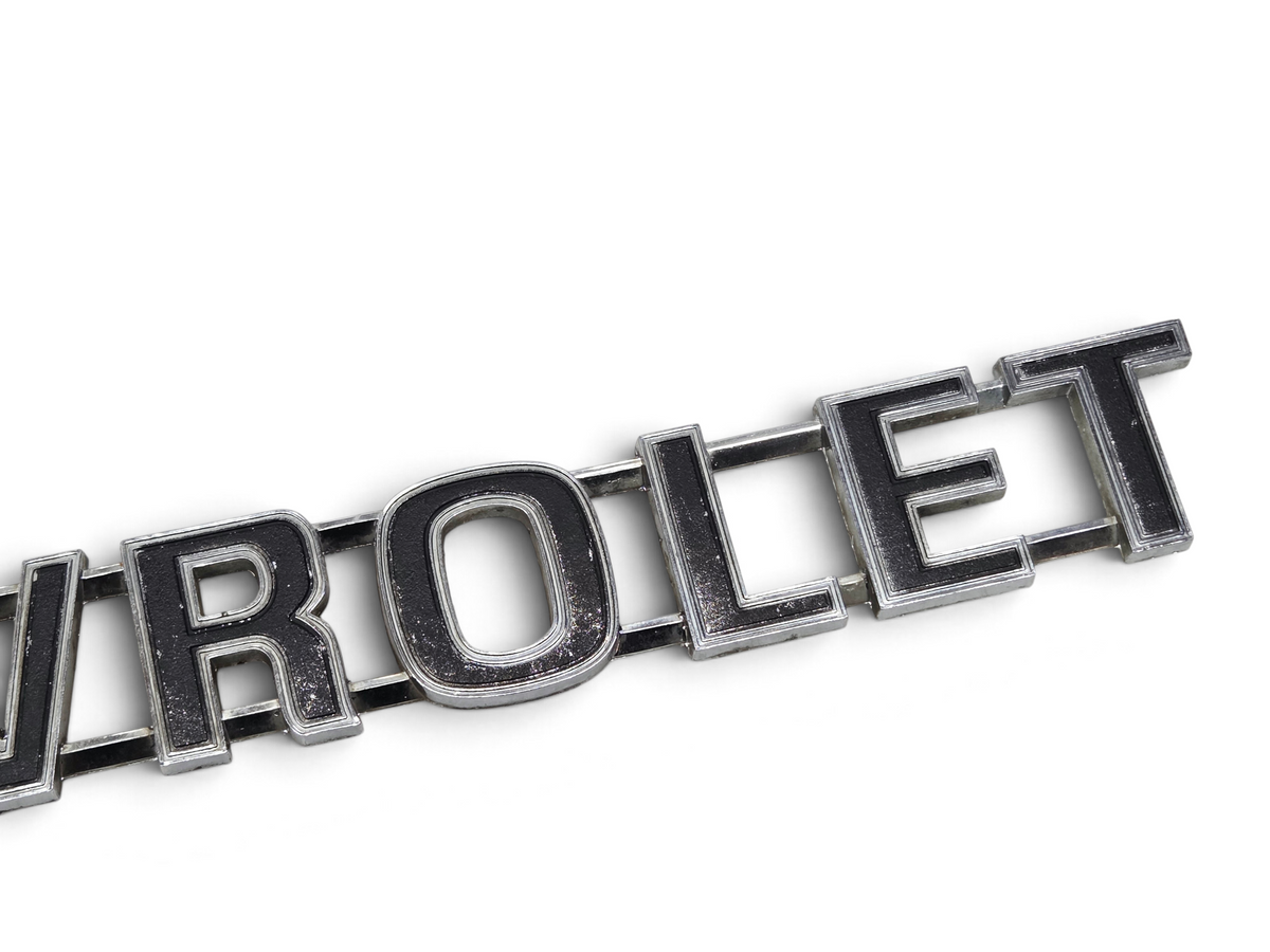 Send it Auto Parts vintage chrome Chevrolet truck tailgate emblem with black lettering and minor surface wear