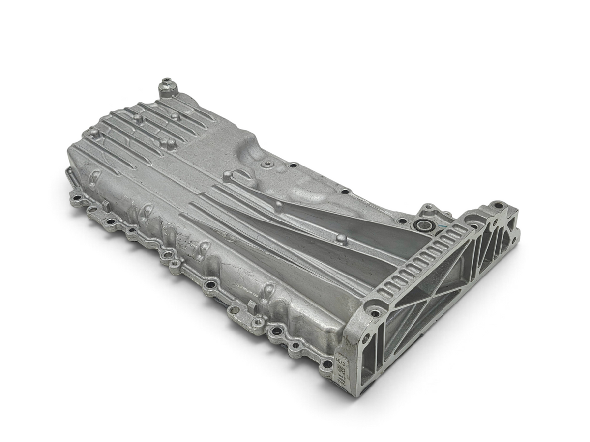 Send it Auto Parts OEM Chevy Corvette C8 6.2L engine oil pan with baffle, showing silver cast metal construction.