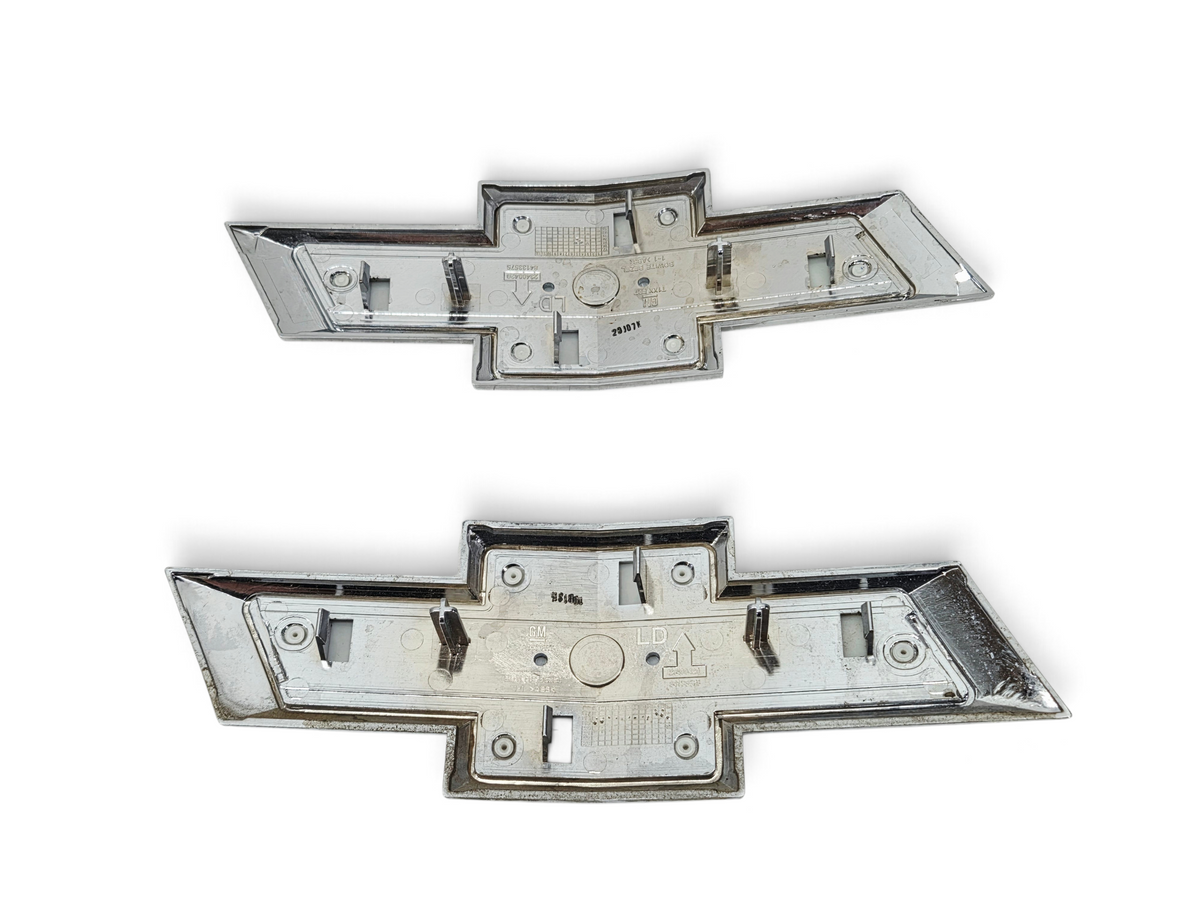 Send it Auto Parts lot of four genuine OEM gold Chevrolet Silverado 1500 front grille bowtie emblems, rear view