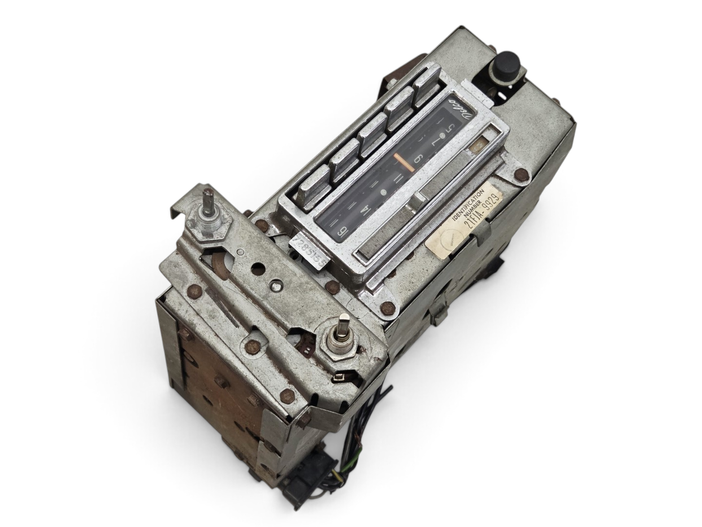 Send it Auto Parts OEM GM 1963-1967 Corvette C2 AM FM radio unit with metal casing and vintage dial display