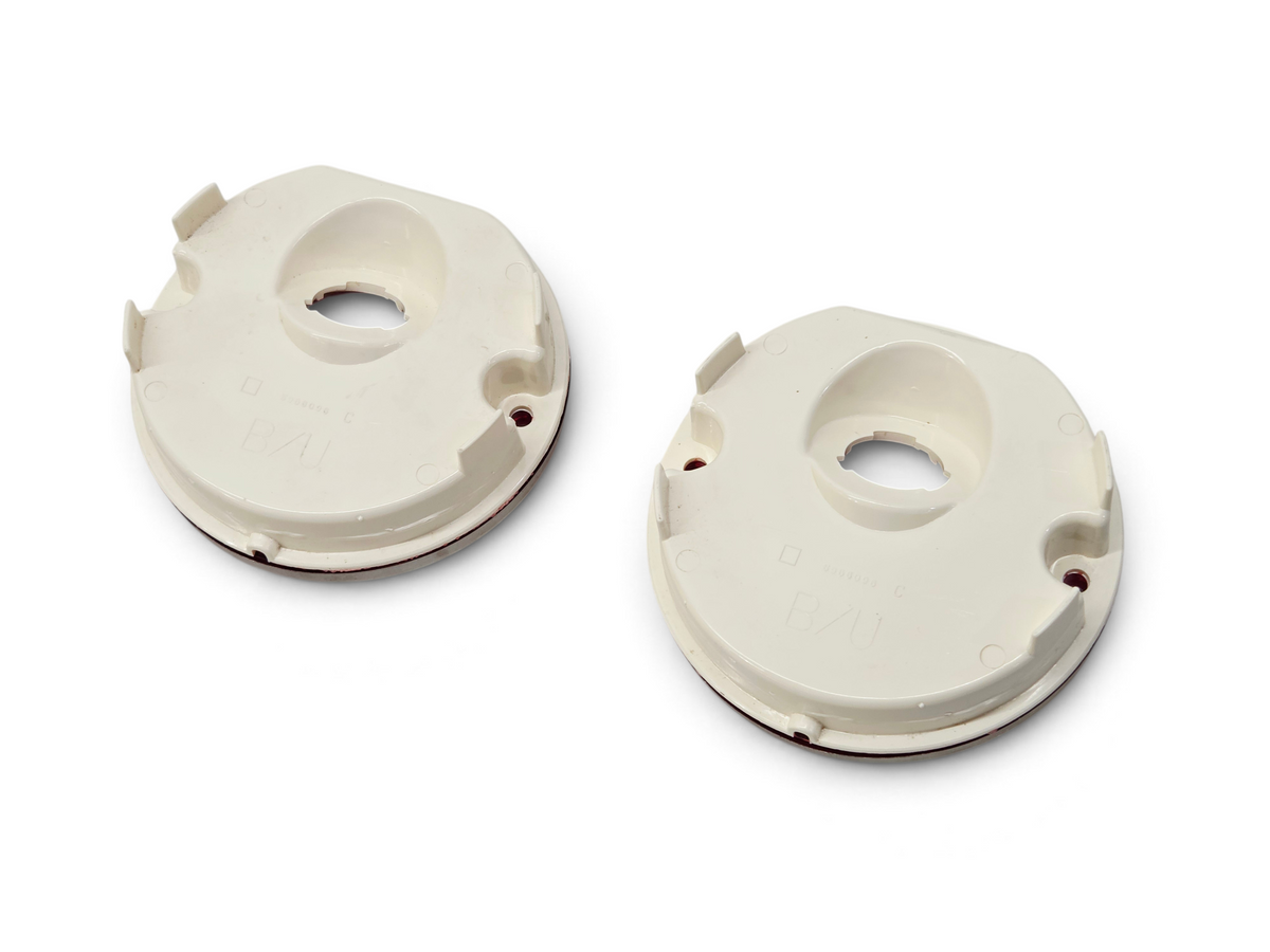 Send it Auto Parts OEM GM backup reverse lamp lenses for 1975-1979 Corvette C3, showing the white plastic back side.