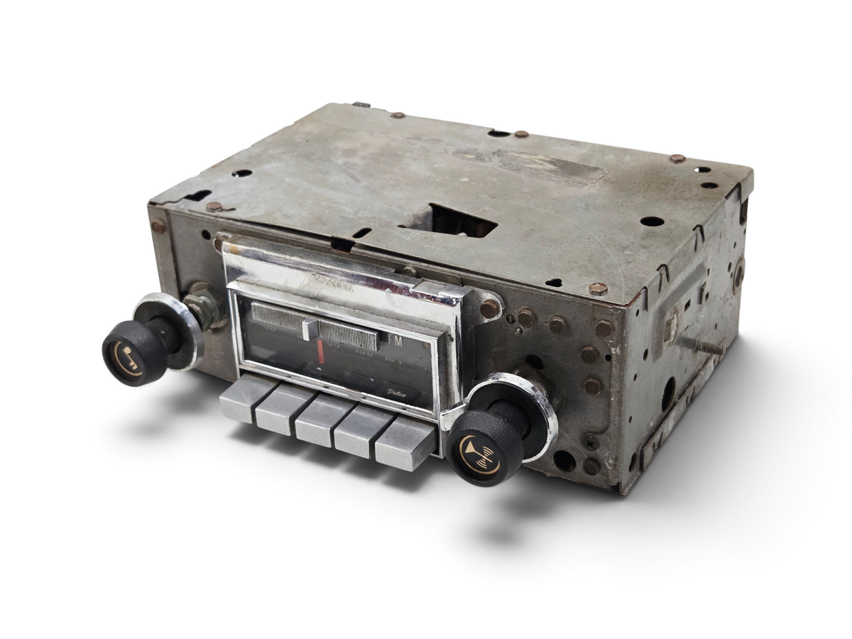 Send it Auto Parts vintage 1972-1976 Corvette C3 Delco AM FM radio with chrome faceplate and black knobs