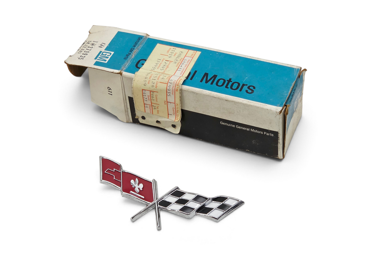 Send it Auto Parts OEM 1977 Corvette C3 fuel door cross flag emblem with original General Motors packaging