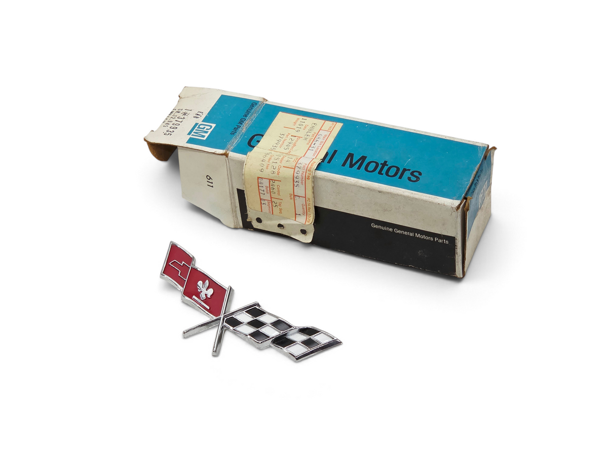 Send it Auto Parts OEM 1977 Corvette C3 fuel door cross flag emblem in original General Motors box