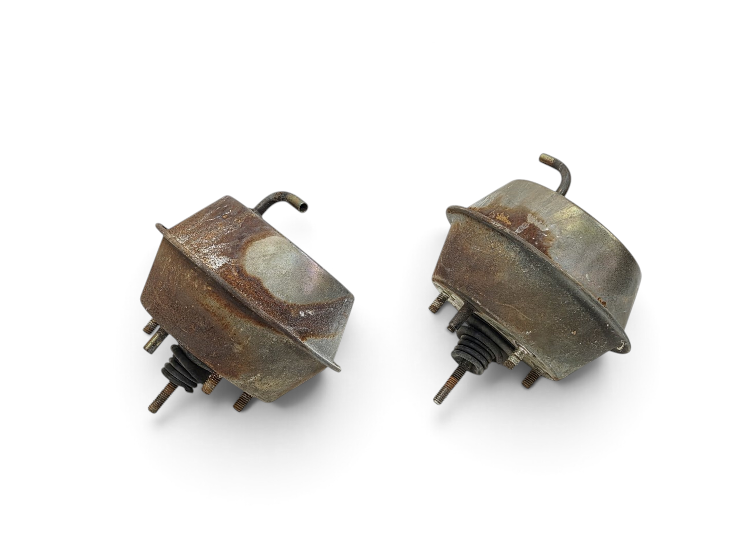 Send it Auto Parts OEM GM vacuum headlight actuators for 1968-1982 Corvette C3, showing signs of aged metal finish.
