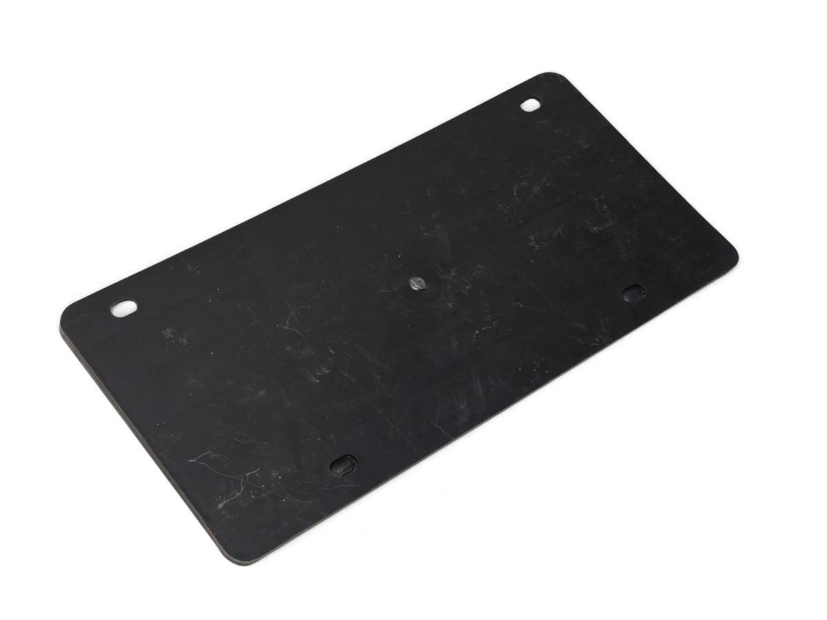 Send it Auto Parts black front license plate filler for 1975-1979 Corvette C3, designed to match side grille style.