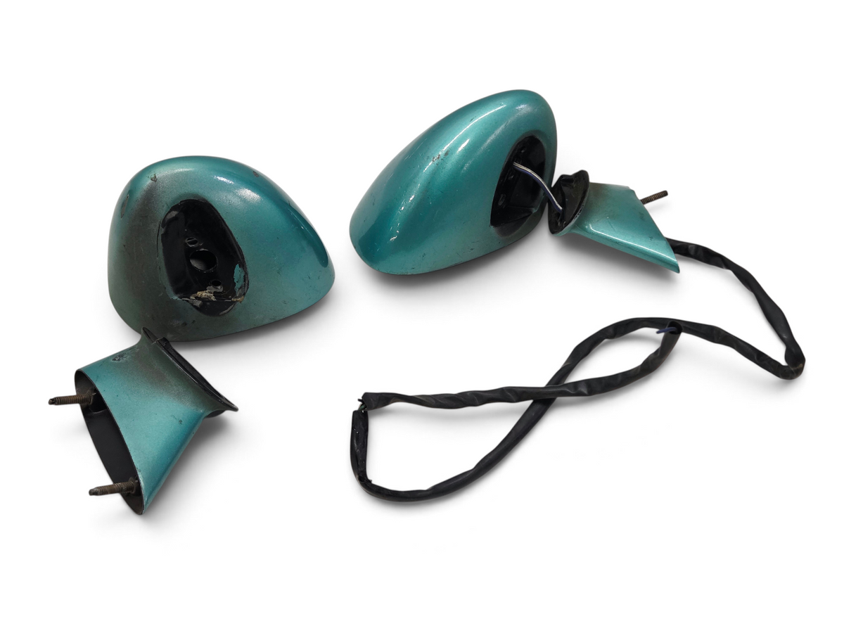 Send it Auto Parts OEM GM rear view mirrors for 1978-1982 Corvette C3 in teal green, requiring paint and restoration.