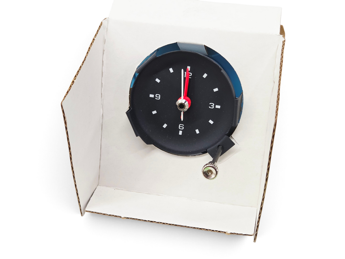 Send it Auto Parts 1977 Corvette C3 quartz clock with black face and red second hand in original packaging