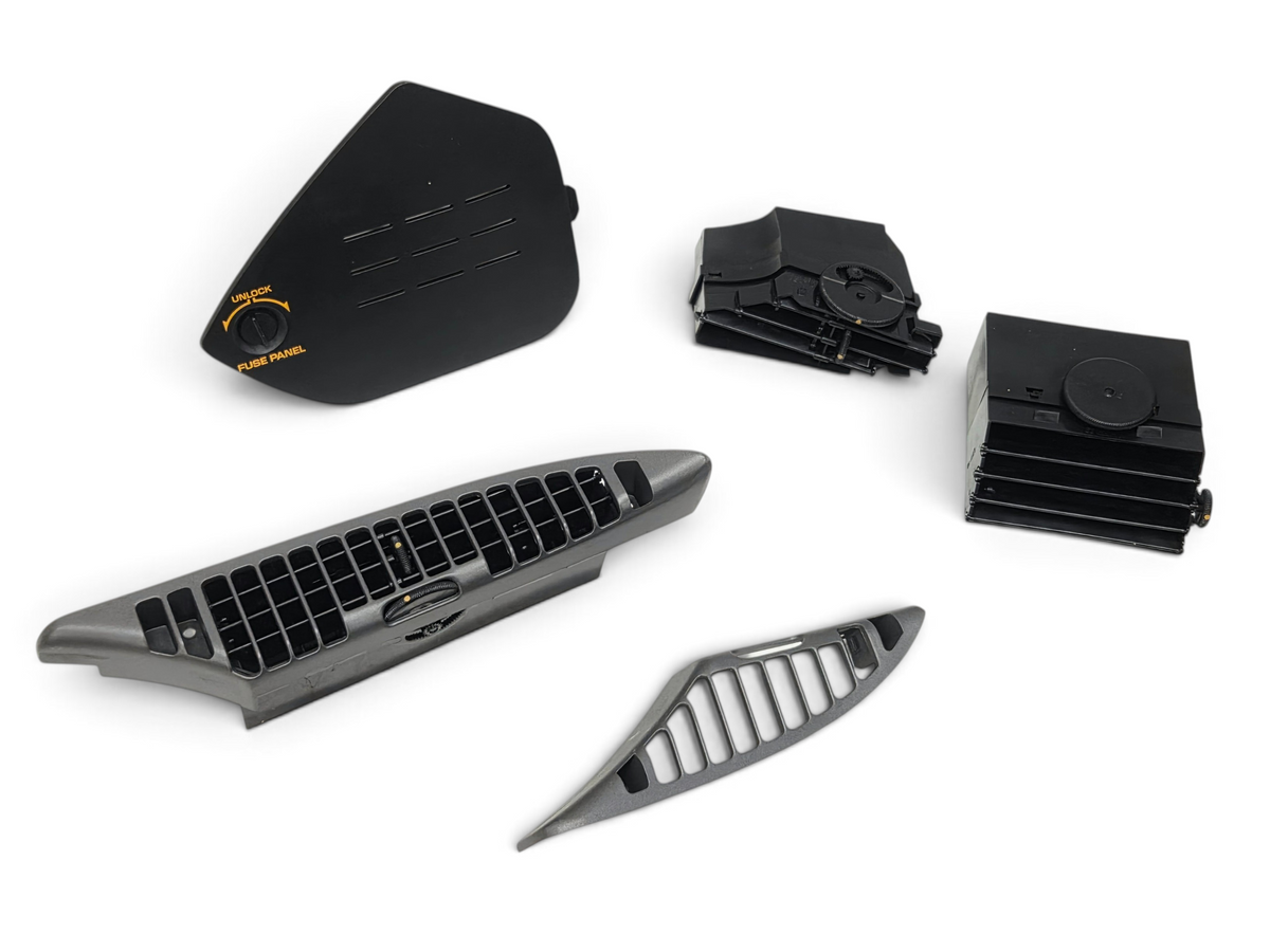 Send it Auto Parts OEM black plastic dash vents and fuse panel cover for 1990-1991 Corvette C4 interior restoration