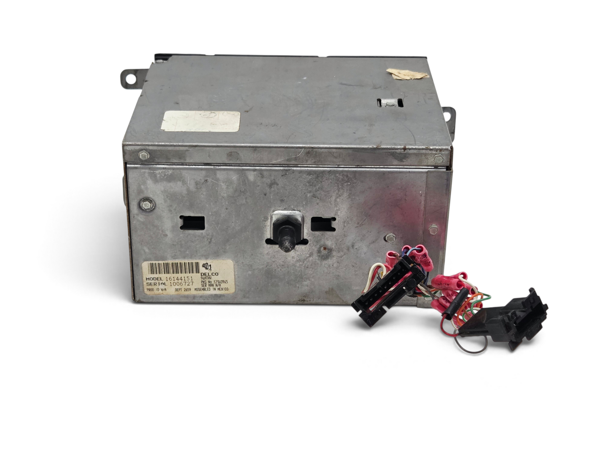 Send it Auto Parts OEM GM 16144151 radio unit for 1990-1991 Corvette C4, showing rear metal casing and wiring harness