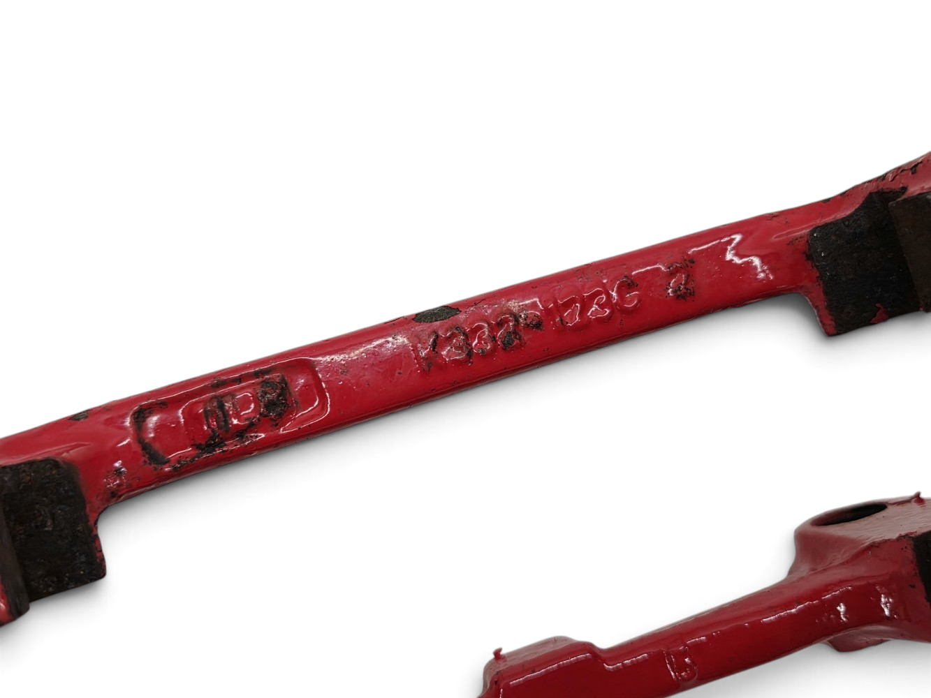 Send it Auto Parts OEM GM Corvette C5 rear brake caliper brackets with red painted finish and visible chipping