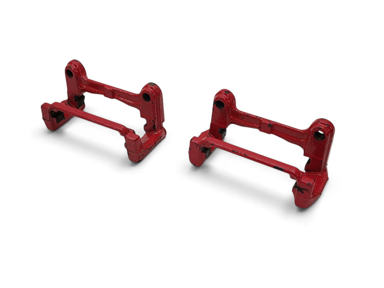 Send it Auto Parts OEM GM rear brake caliper brackets for 2001-2004 Corvette C5, painted red with chipped finish.