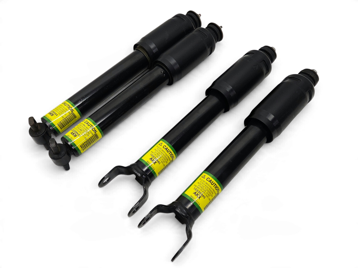 Send it Auto Parts OEM black front and rear shock absorbers for 2004 Corvette C5 Z06 with yellow caution labels