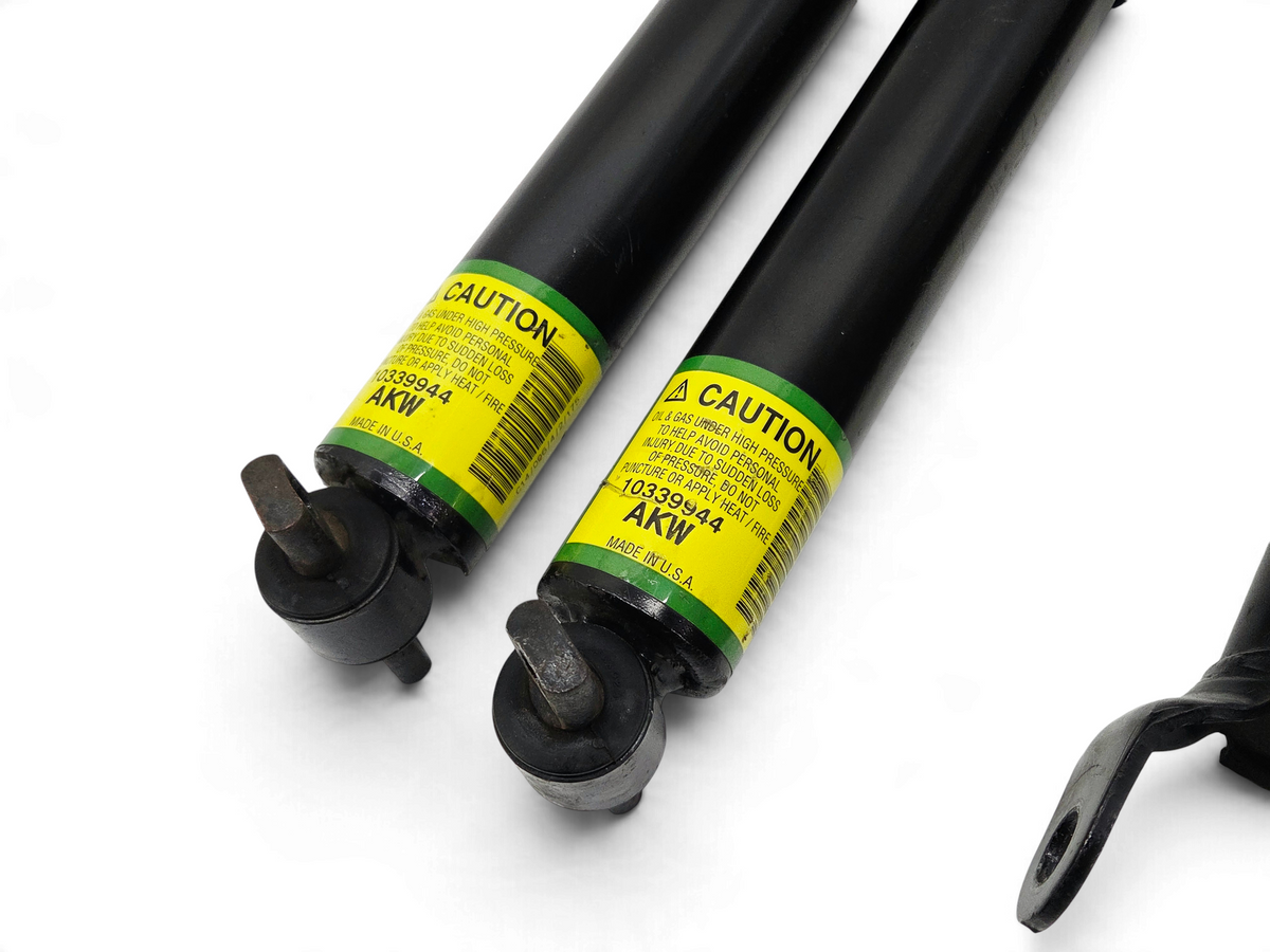 Send it Auto Parts OEM black front and rear shock absorbers for 2004 Corvette C5 Z06 with yellow caution labels