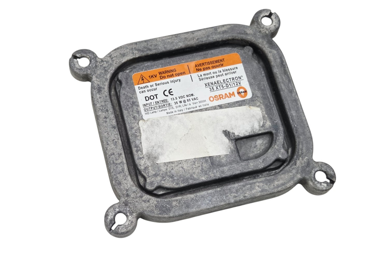 Send it Auto Parts OEM GM Corvette C6 headlight ballast module with Osram Xenaelectron label and mounting tabs.
