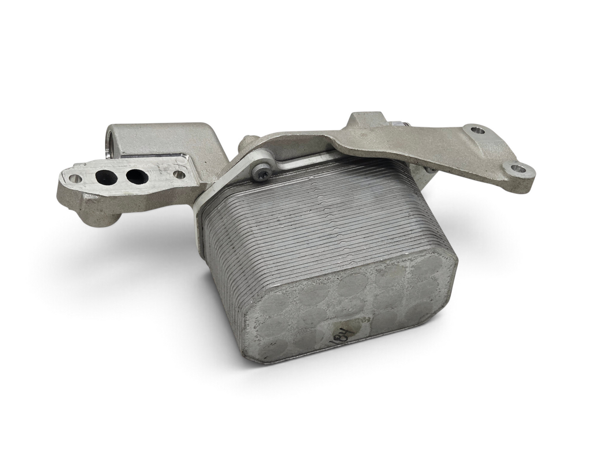 Send it Auto Parts OEM GM engine oil cooler for 2015-2019 Corvette C7 Z06 LT4, showing metal cooling fins and bracket.