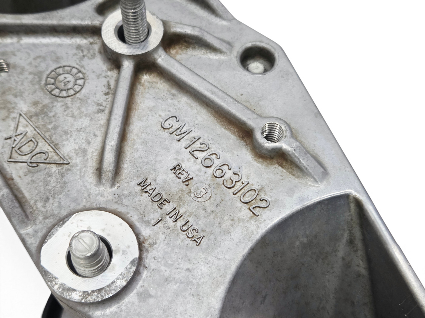Send it Auto Parts OEM GM 12663102 tensioner bracket for Corvette C7 Z06 showing part number and Made in USA stamp