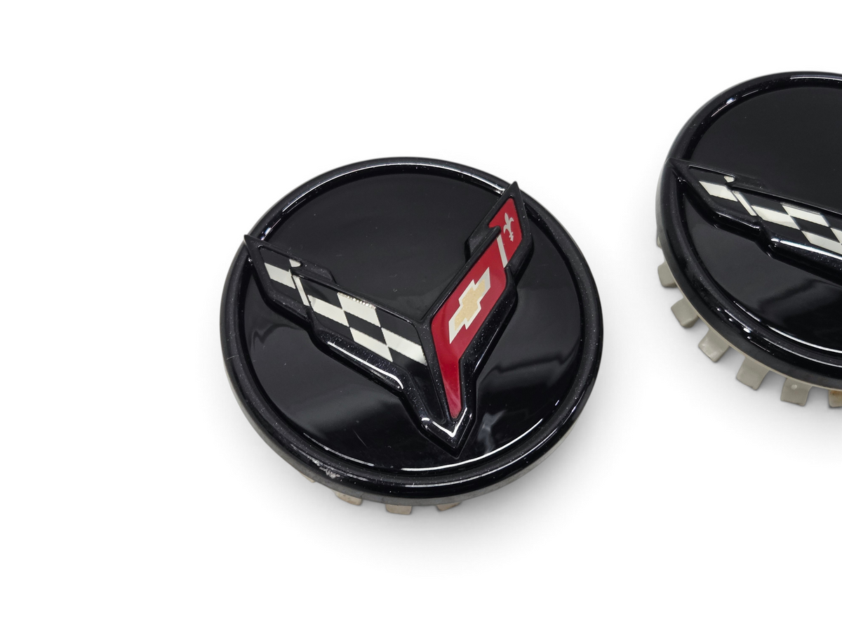 Send it Auto Parts OEM gloss black wheel center caps for 2020-2026 Corvette C8 Stingray with checkered flag emblem