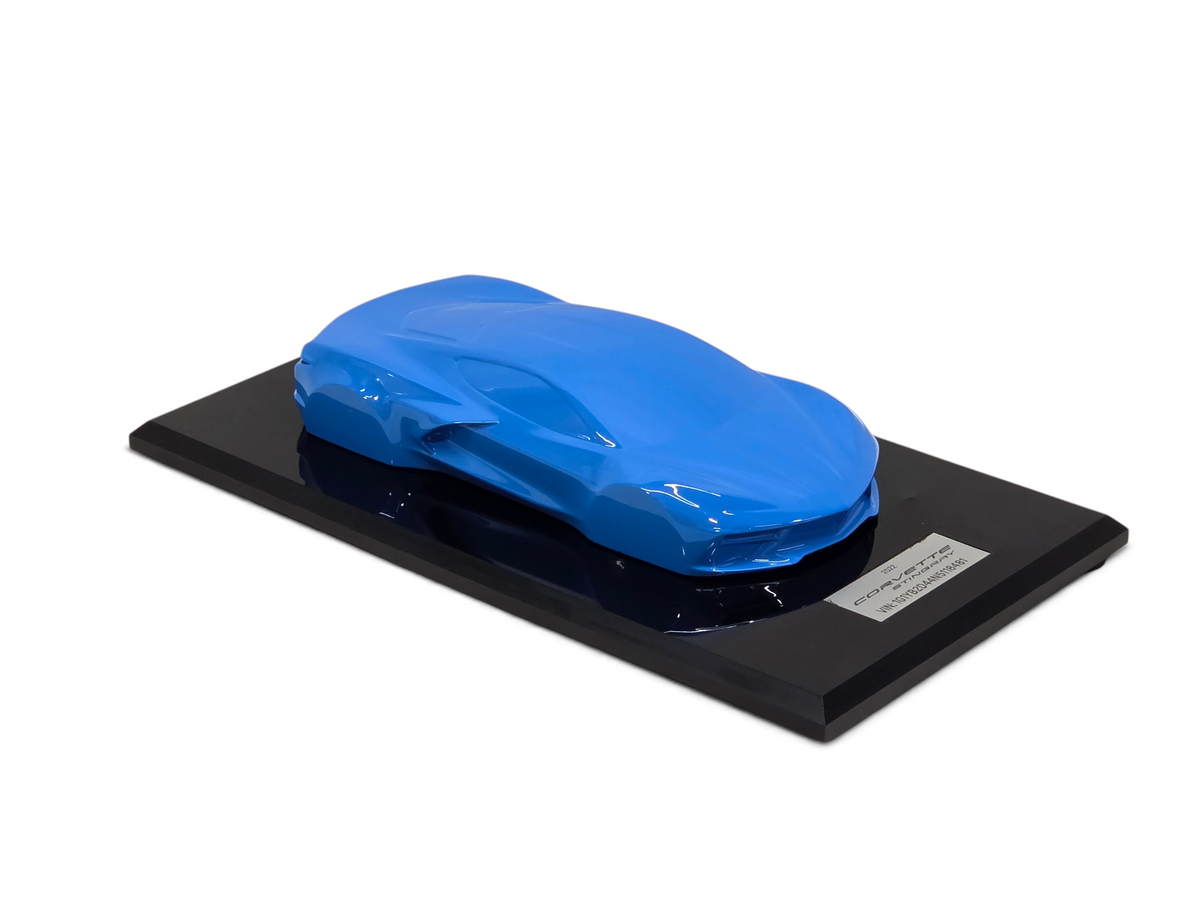 Send it Auto Parts 2022 Corvette C8 Stingray speed shape model in Rapid Blue on a black display base